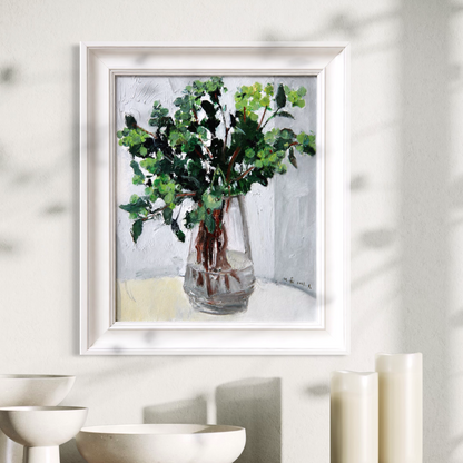 Original greenery still life oil painting framed in soft ivory wood and styled in a calm minimalist interior with sculptural ceramic decor.