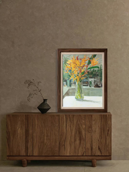 Framed original oil painting featuring Bird of Paradise flowers displayed in a contemporary interior, creating a vibrant focal point and natural elegance.