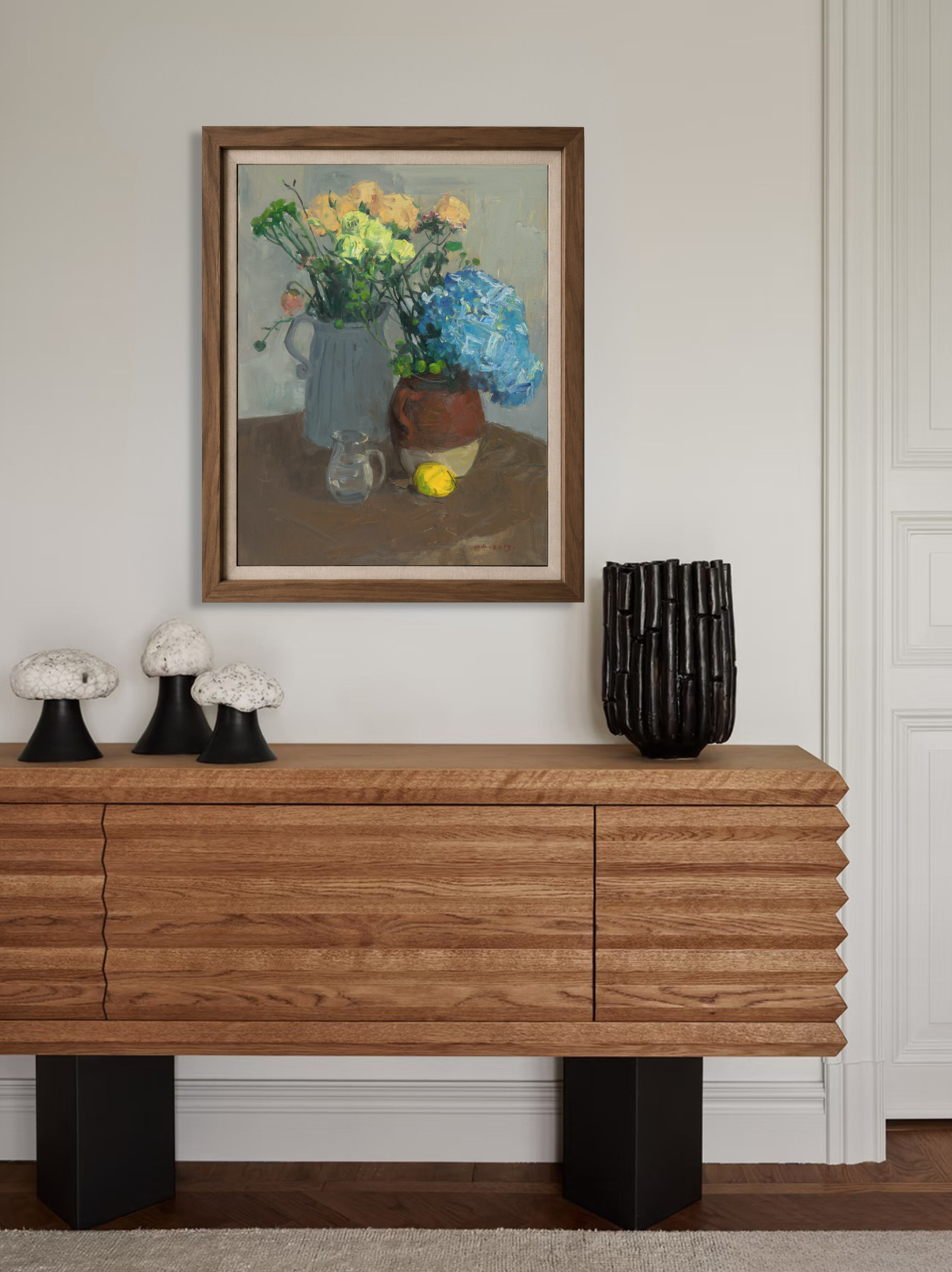 Framed oil painting featuring blue hydrangea and yellow roses displayed in a contemporary interior, creating a sophisticated floral focal point.