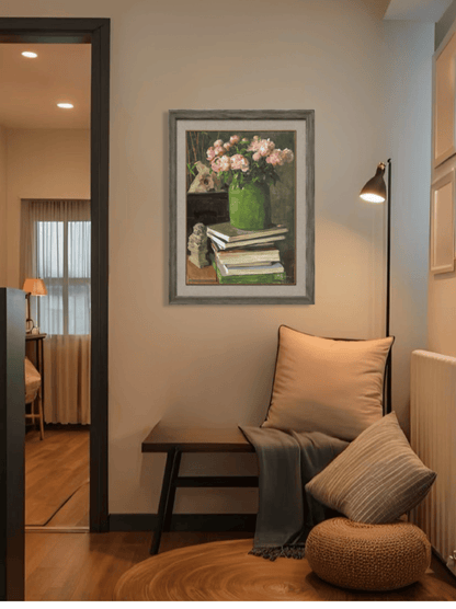 Original oil painting featuring books and pink flowers displayed in bedroom interior, enhancing calm, warmth, and personal character.