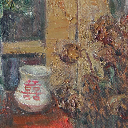 Detailed view of a ceramic jar and natural decorative objects, emphasizing texture, earthy colors, and the quiet atmosphere of the interior composition.