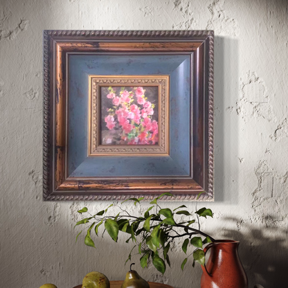 Original floral oil painting in a vintage-inspired blue wood frame displayed in a calm interior with natural light and botanical styling.