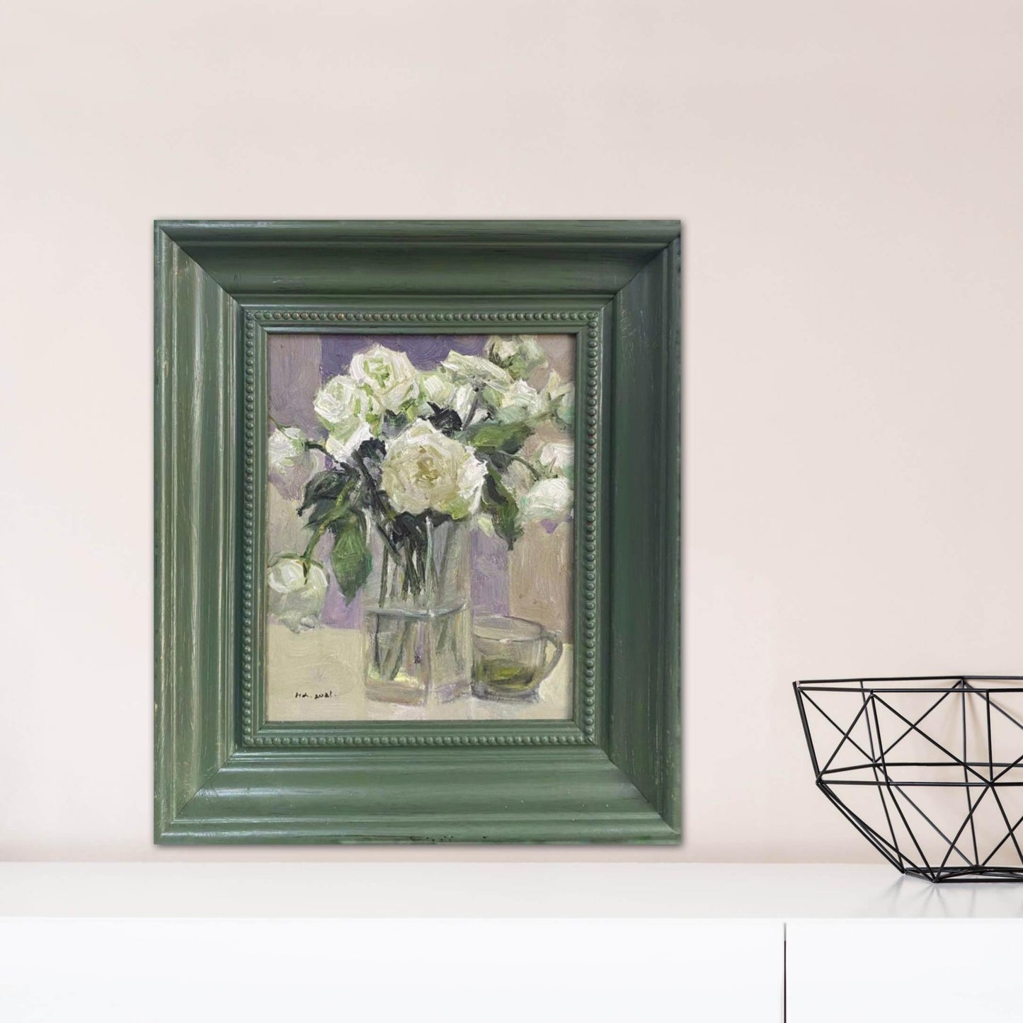 Still life oil painting of white flowers styled in a refined interior with layered frames and soft lighting. The artwork combines painterly texture with a timeless gallery-style presence.