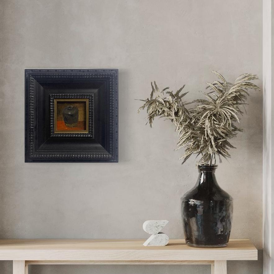 Original still life oil painting in a dark vintage-inspired frame styled with ceramic decor and dried branches in a minimalist home setting.
