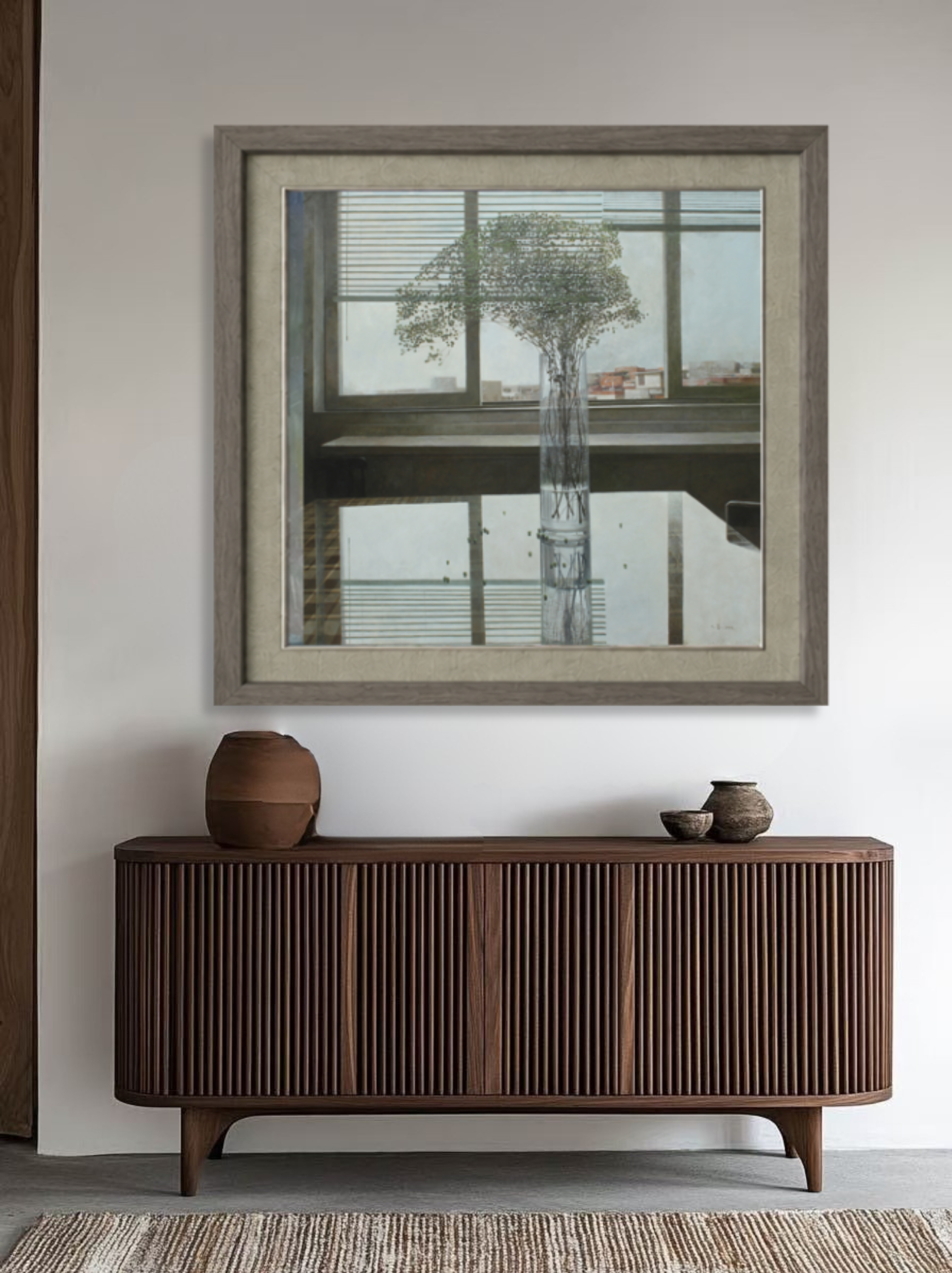 Original oil painting displayed above a wooden cabinet, bringing minimalist elegance and serene floral presence to the interior.