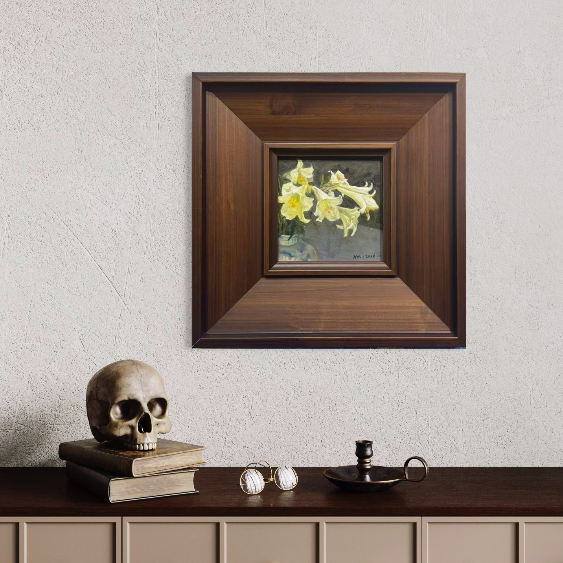 Original floral oil painting in a walnut gallery frame displayed in a moody contemporary interior with sculptural decor and warm wood tones.