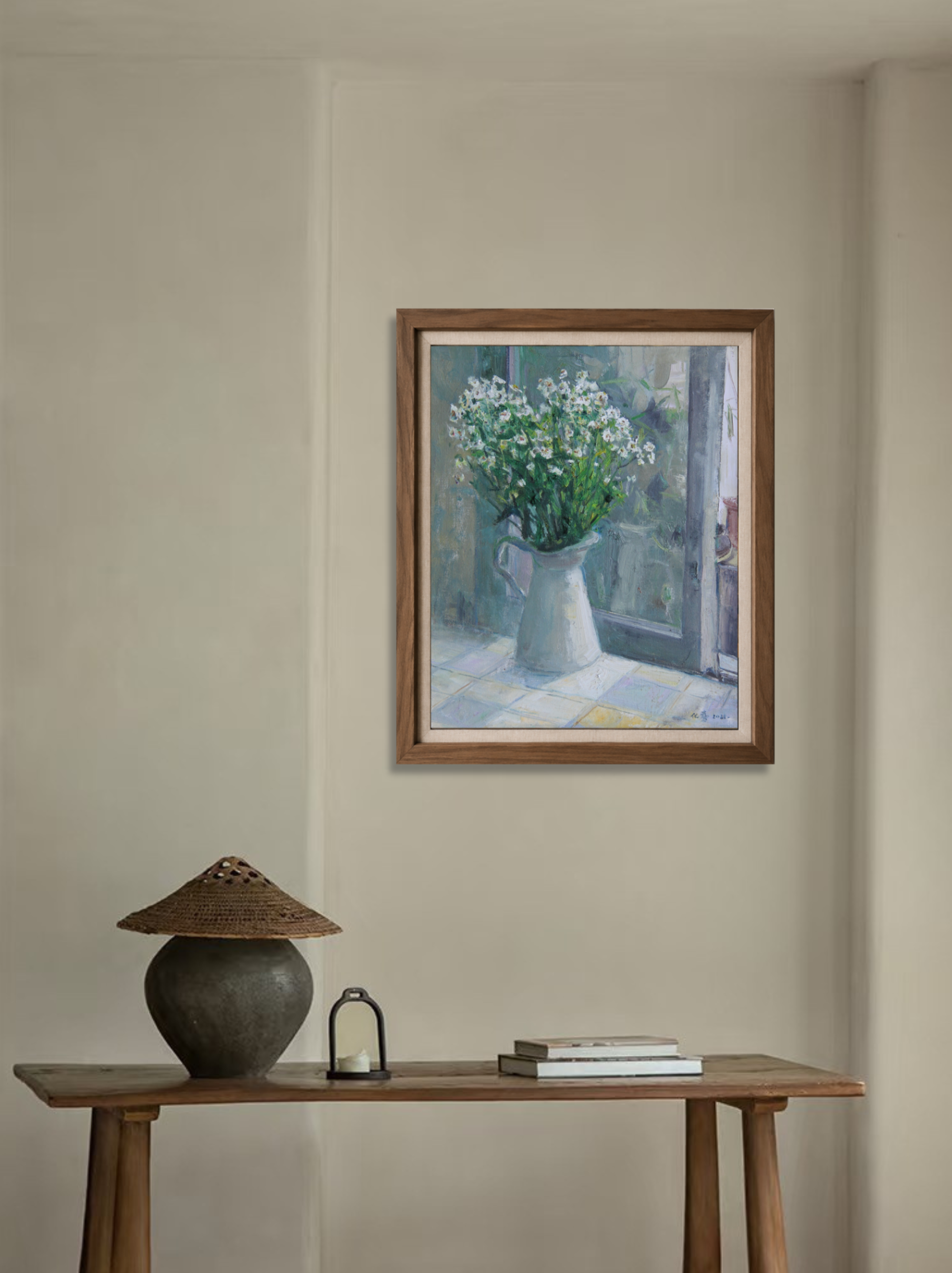 Original interior still life painting displayed above a wooden cabinet, bringing calm, natural tones and soft artistic presence to the home space.
