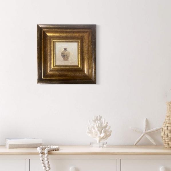 Small framed still life oil painting styled above a white mantel in a calm minimalist interior with soft neutral decor.