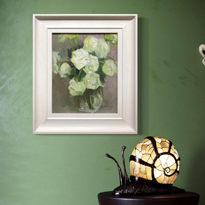 Original white flower oil painting displayed in a soft green interior space. The light-toned frame and muted palette create a calm, refined atmosphere suitable for modern and classic homes.