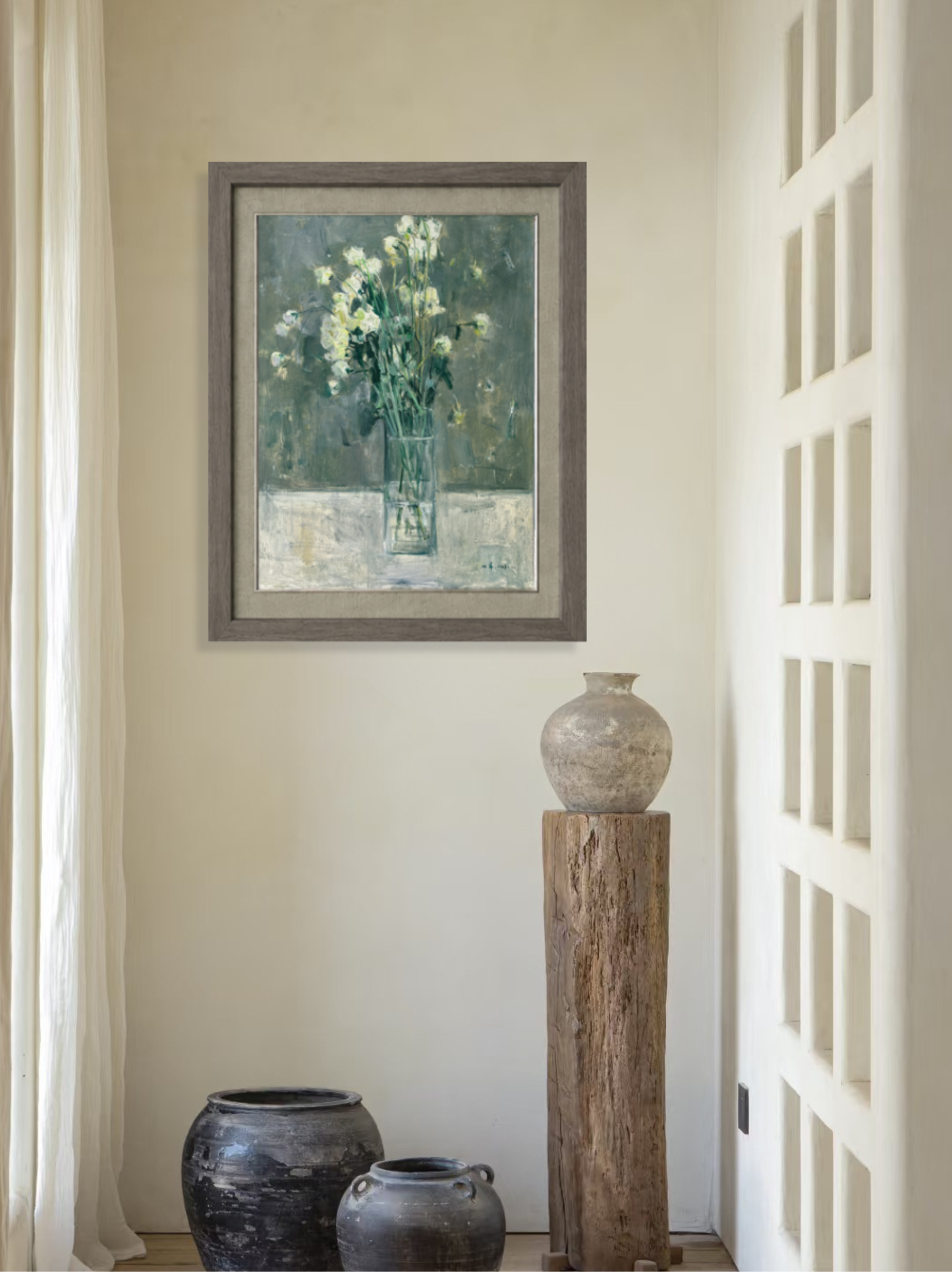 Framed original oil painting featuring green flowers displayed in a minimalist interior, adding softness, depth, and quiet visual presence to the room.