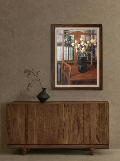 Original oil painting featuring dried roses, a black vase, and bookshelf elements displayed in a calm interior, adding depth, warmth, and quiet visual presence.
