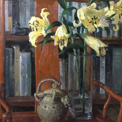 Close-up detail of lilies arranged beside books, showing layered brushwork, warm light, and a refined interior still life composition.