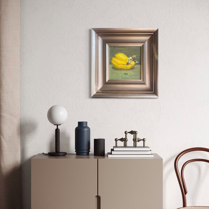 A miniature still life oil painting styled in a neutral contemporary room with soft beige walls and minimal furnishings, bringing subtle color and painterly texture into the space.