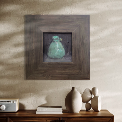 A small original still life oil painting displayed in a neutral interior space. The weathered wooden frame and soft lighting give the artwork a grounded and timeless presence.