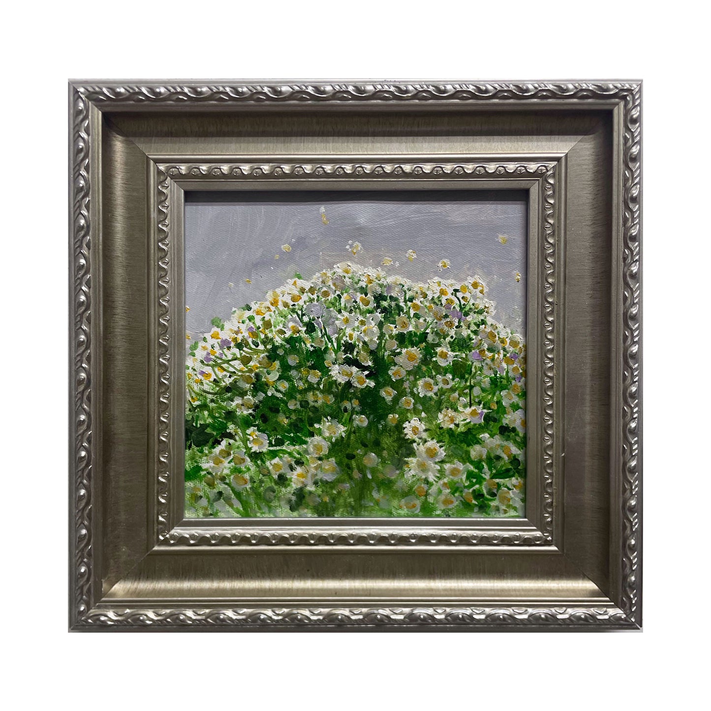 An original oil painting featuring a dense field of white daisies painted with layered green and cream tones, presented in a vintage silver-toned frame. The artwork combines textured brushwork, soft light, and a calm floral atmosphere suitable for elegant interiors.