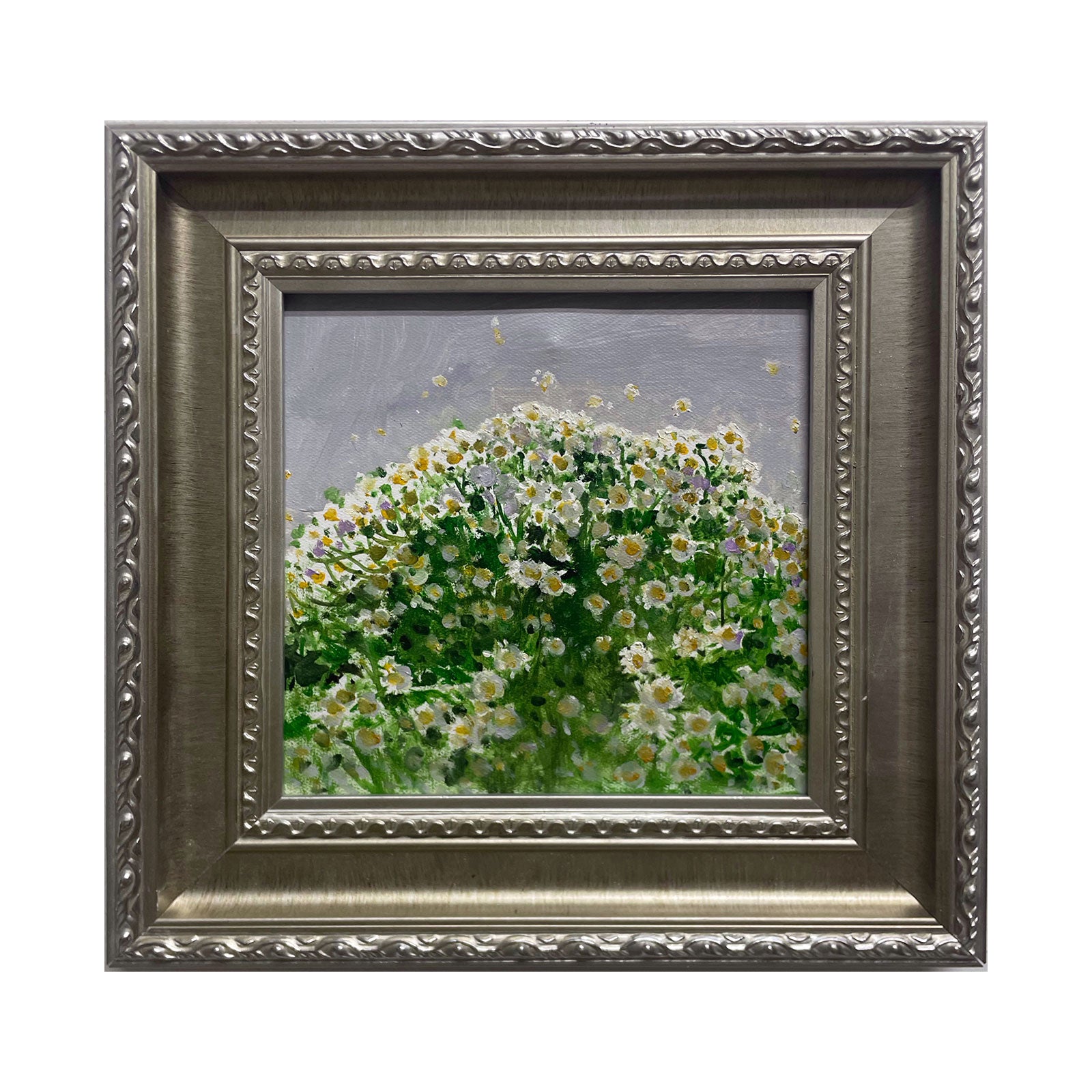 An original oil painting featuring a dense field of white daisies painted with layered green and cream tones, presented in a vintage silver-toned frame. The artwork combines textured brushwork, soft light, and a calm floral atmosphere suitable for elegant interiors.