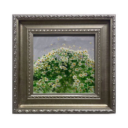 An original oil painting featuring a dense field of white daisies painted with layered green and cream tones, presented in a vintage silver-toned frame. The artwork combines textured brushwork, soft light, and a calm floral atmosphere suitable for elegant interiors.