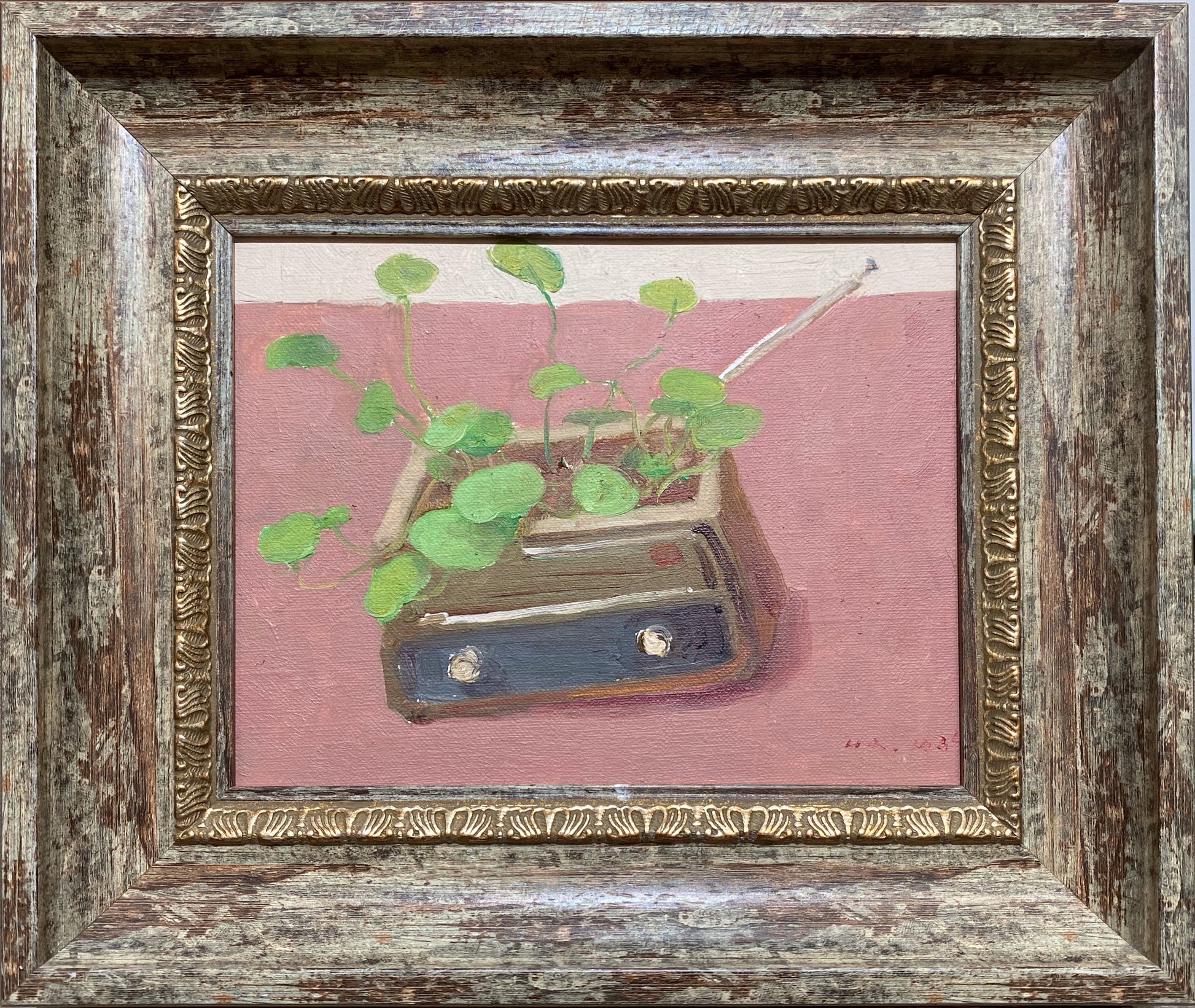 A small original oil painting featuring a green plant growing from a vintage ceramic pot. Framed and ready to hang, this botanical still life highlights soft color harmony and expressive brushwork.