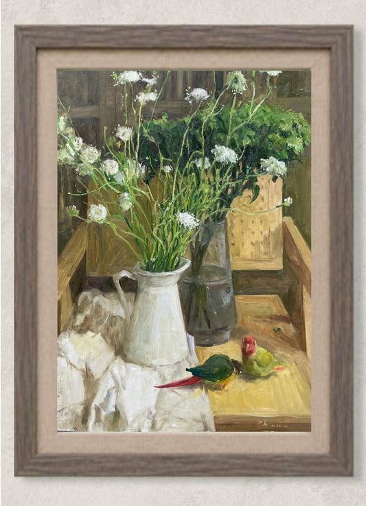 Original oil painting featuring white wildflowers in a glass vase, books, and a colorful parrot arranged on a wooden table. Painted by Hua Xi Yang with warm natural light and rich still life details.