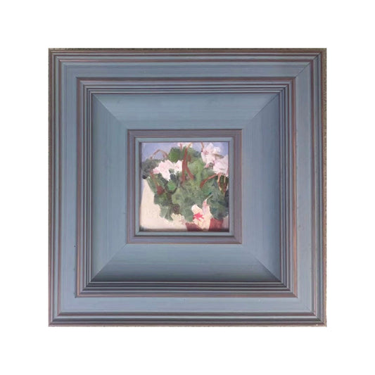 Original floral oil painting featuring soft pink and white flowers, presented in a muted blue wooden gallery frame with calm contemporary character.