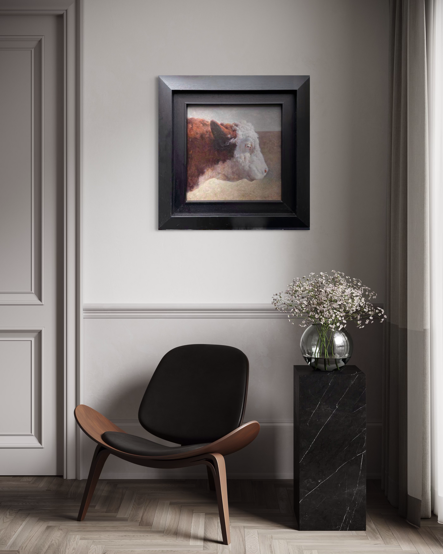 A small framed cow portrait painting displayed in a calm neutral home interior with soft lighting and minimal furnishings, bringing a quiet rural atmosphere into the modern space.