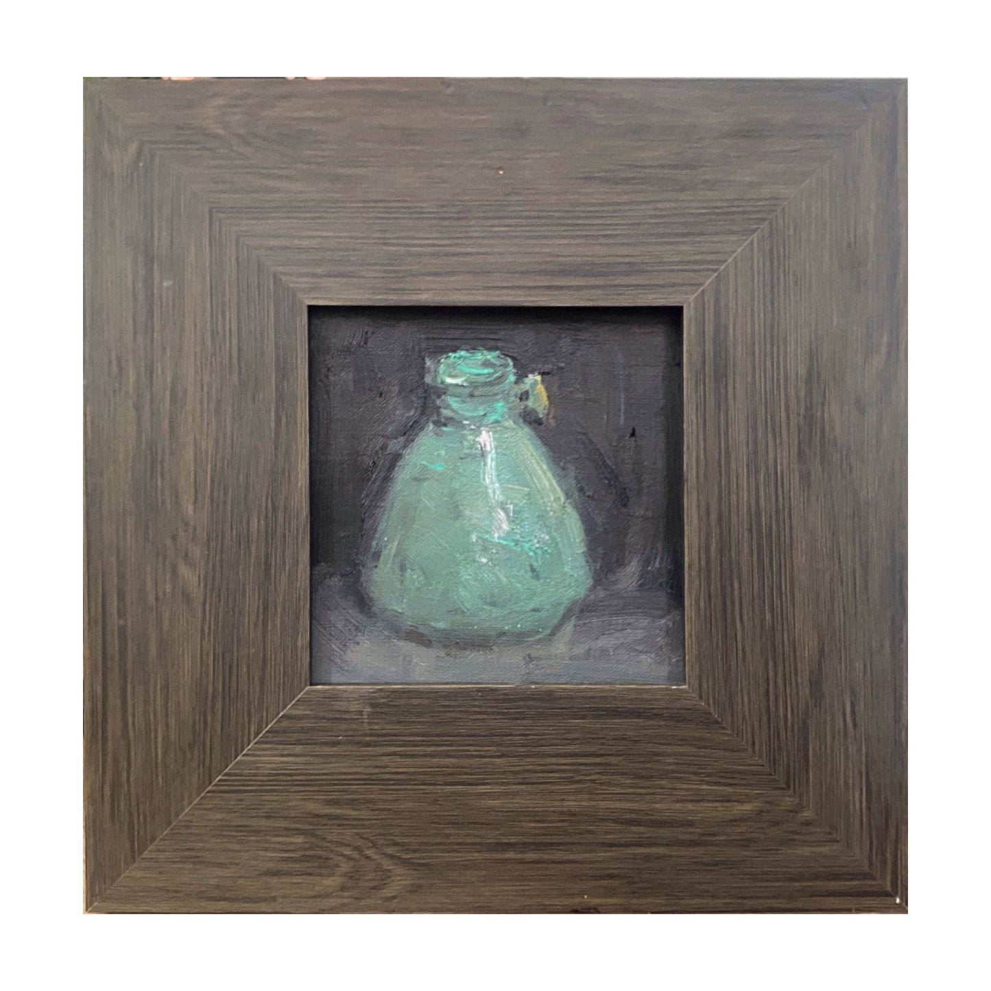 Original oil painting of a green glass vase set against a dark background, framed in a textured rustic wooden frame. The muted palette and layered brushwork create a quiet, contemplative atmosphere.