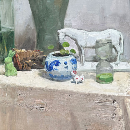 Detail of a white ceramic jar on a wooden table, emphasizing texture, shadows, and interior still life composition.