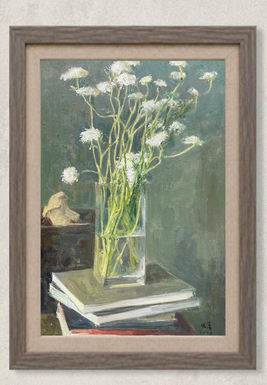 Original oil painting featuring delicate white flowers arranged in a transparent glass vase, placed atop a stack of books with a small decorative object. Painted by Hua Xi Yang with soft natural light and muted background, creating a calm still life composition.