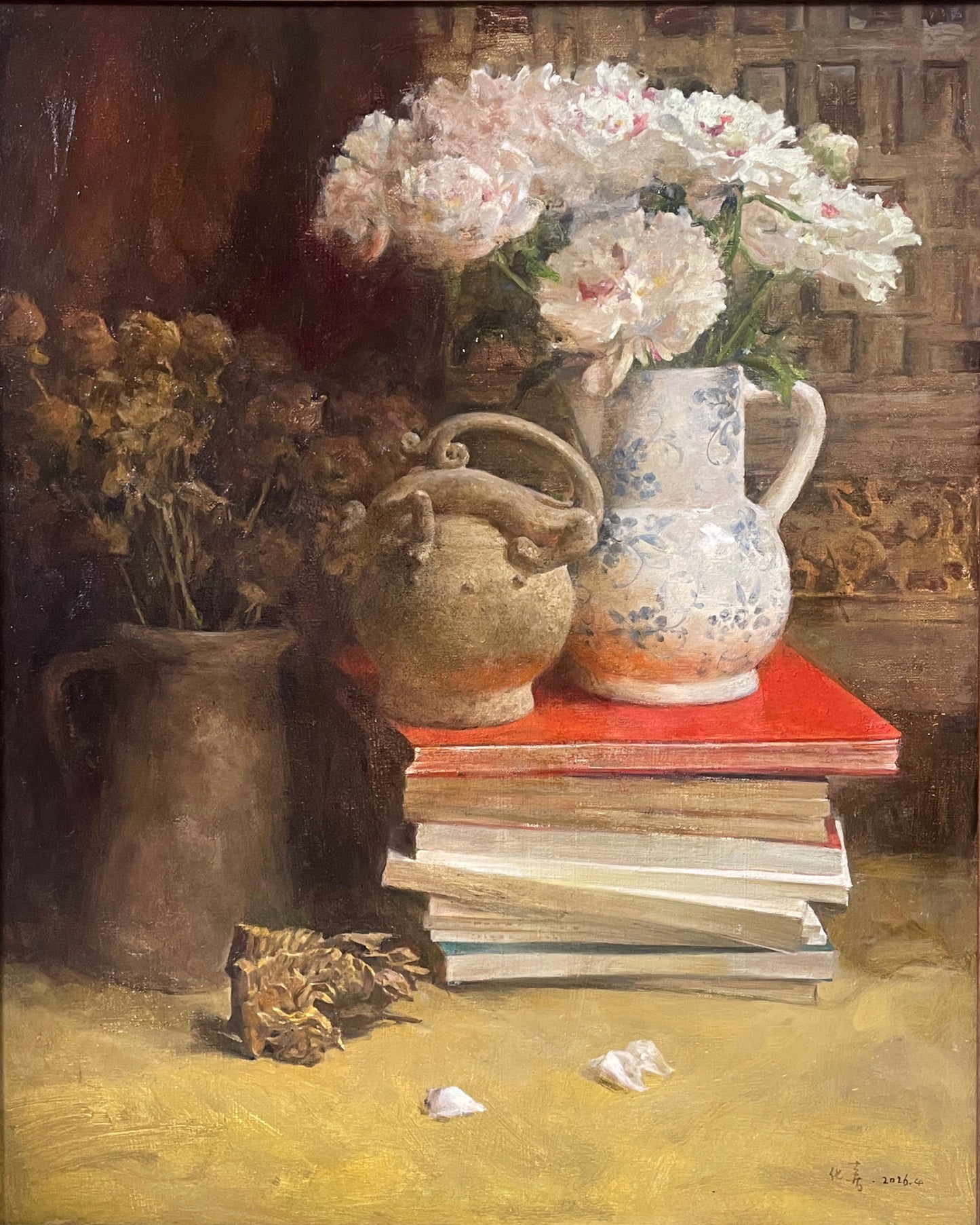 Close-up view of books, flowers and vintage objects arranged in a literary still life composition.
