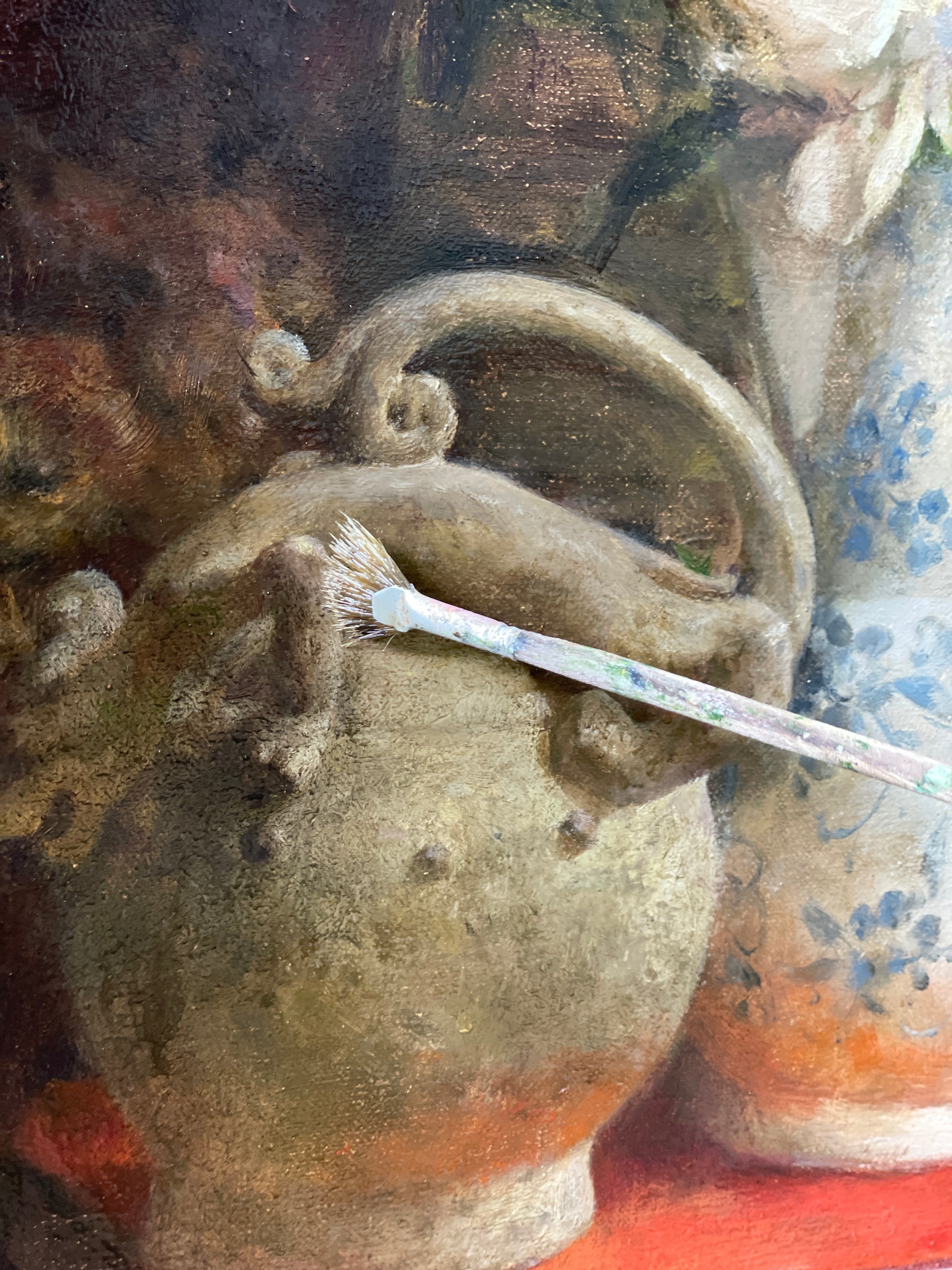Close-up of an aged ceramic pot, highlighting texture, form and the passage of time.