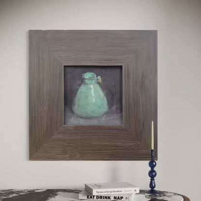 Short reel featuring a small original oil painting of a green glass vase presented in different interior settings. The video highlights textured brushwork, rustic framing, and the quiet atmosphere created by the artwork.