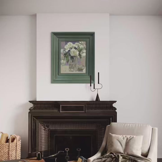 Short reel featuring an original oil painting of white flowers presented across multiple interior scenes. The video highlights the green frame, painterly details, and the quiet atmosphere the artwork brings into living spaces.